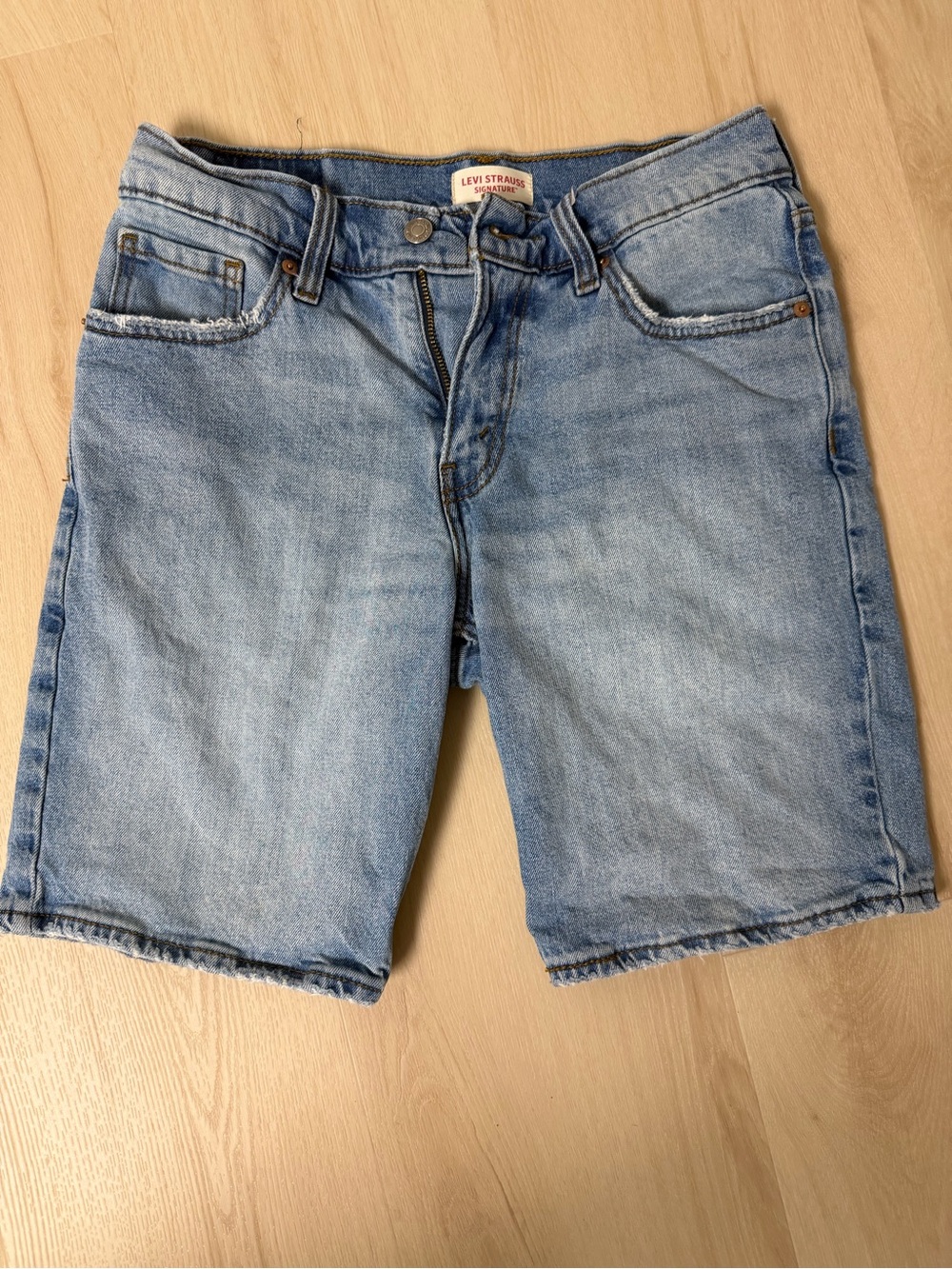 Levi's mid-thigh jean shorts light blue